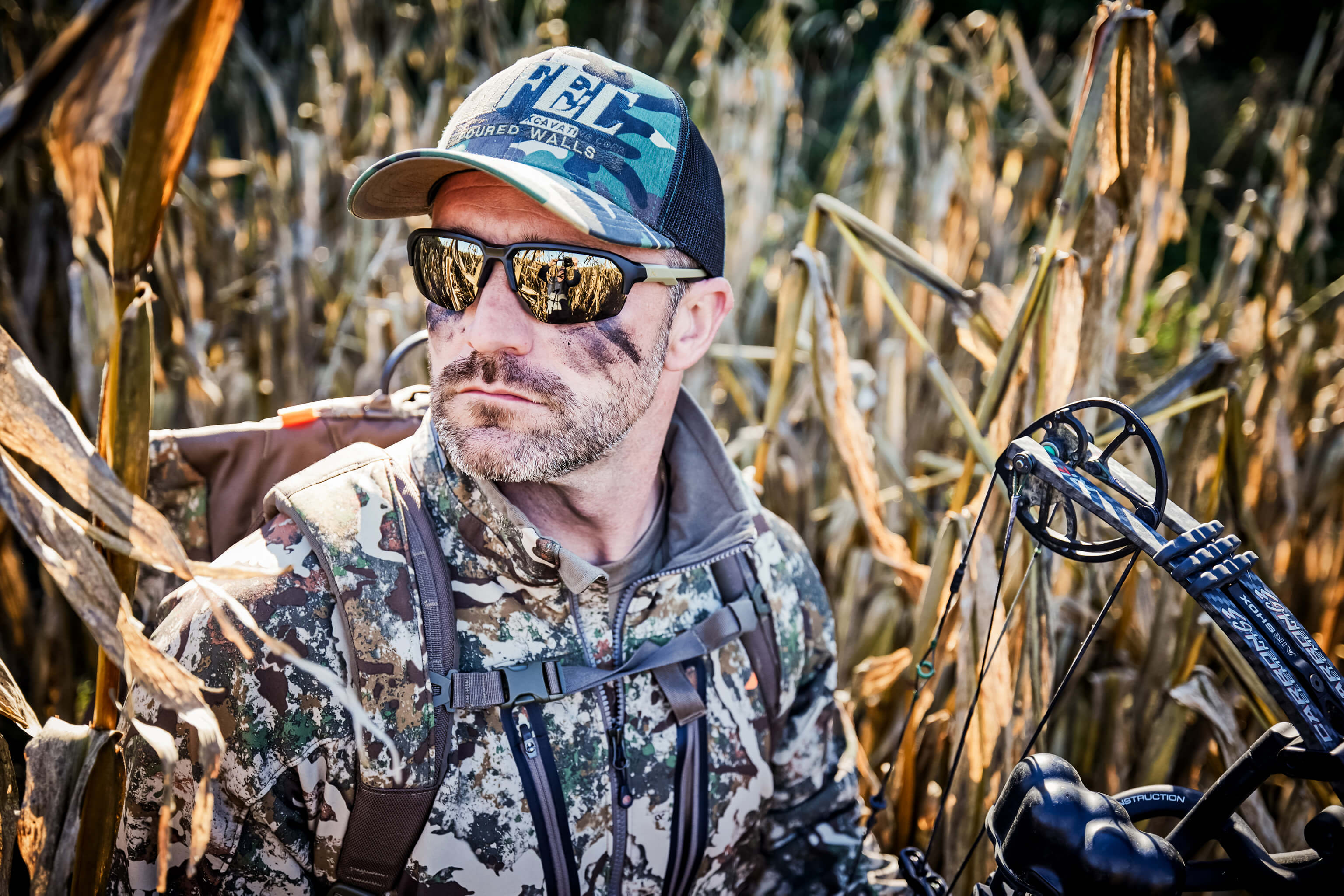 Man bow hunting with the WX Jakl Tungsten Lenses
