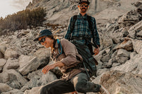 Two hikers on a rocky mountain trail