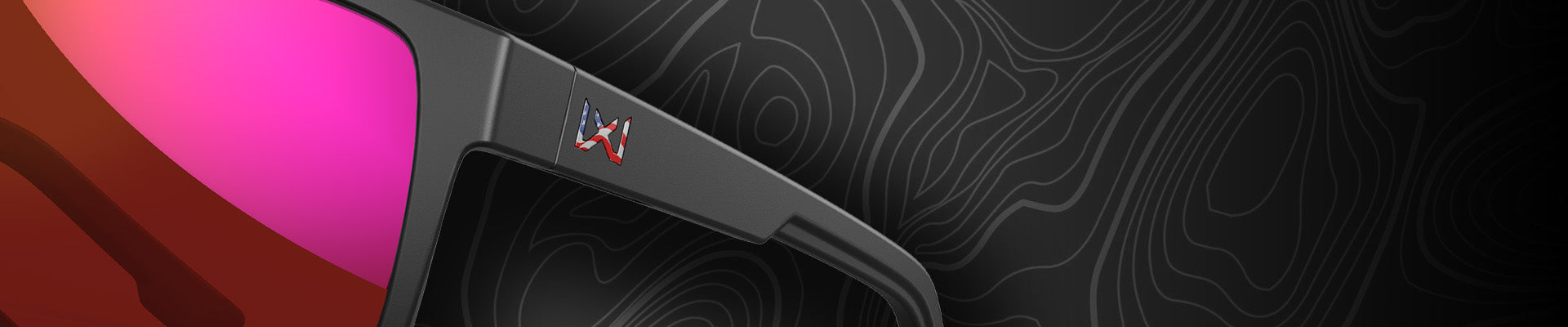 Sunglasses with pink lenses and a dark patterned background