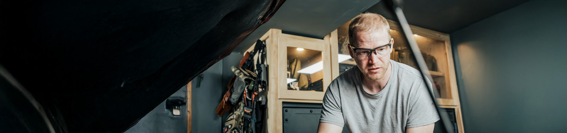 Man with safety glasses working on car
