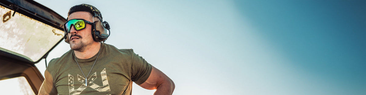 A man at a range wearing the new WX Citadel Sunglasses.